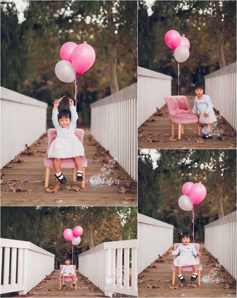 little girl with pink balloons