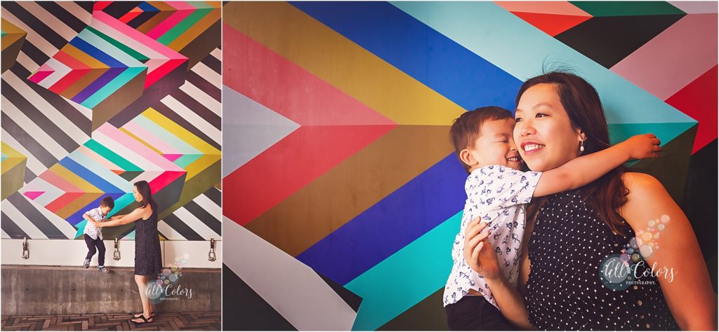 Mother and Son playing in front of a colorful mural in Downtown San Diego.