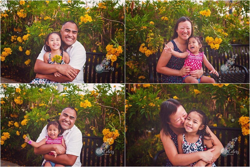 Mom and dad kissing and hugging their little kids at Liberty Station, San Diego CA. 