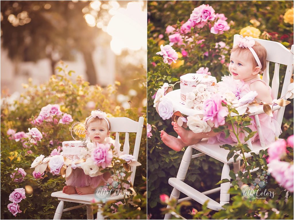 baby girl sitting on a vintage high chair in a rose garden