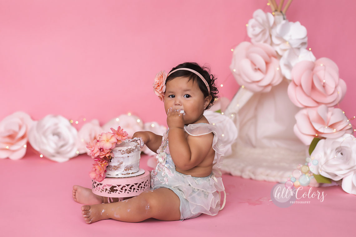 baby eating a cake