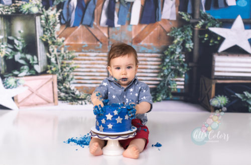 baby boy eating a blue cake