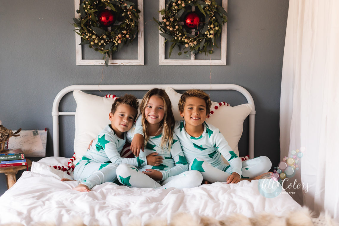 Kids playing in bed celebrating Christmas