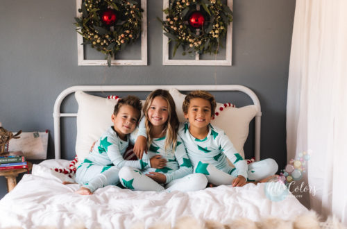Kids playing in bed celebrating Christmas
