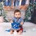 baby boy eating a blue cake