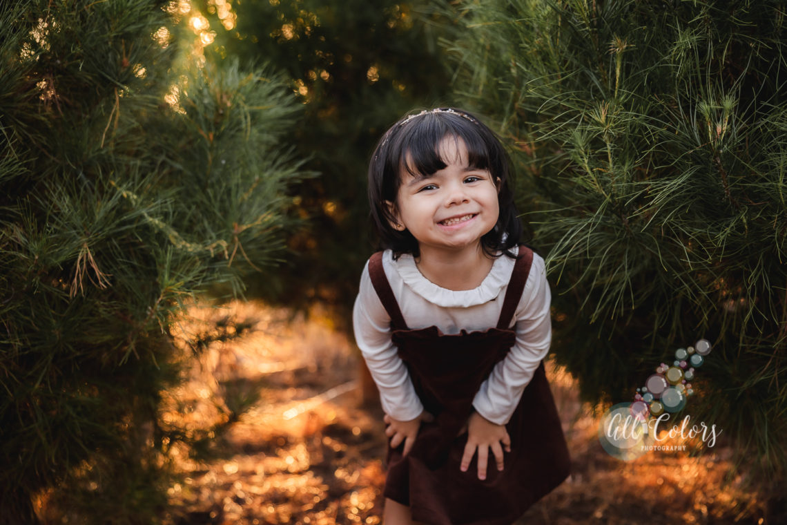 Smiley little girl at a Christmas Tree Farm