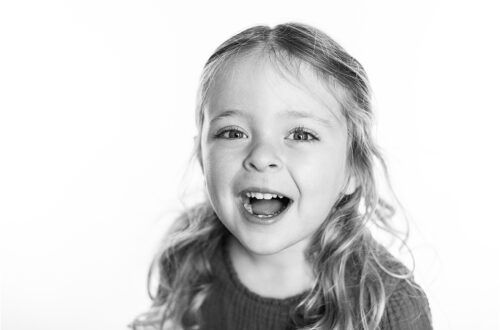 Black and white photo of a preschooler girl.