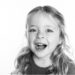 Black and white photo of a preschooler girl.